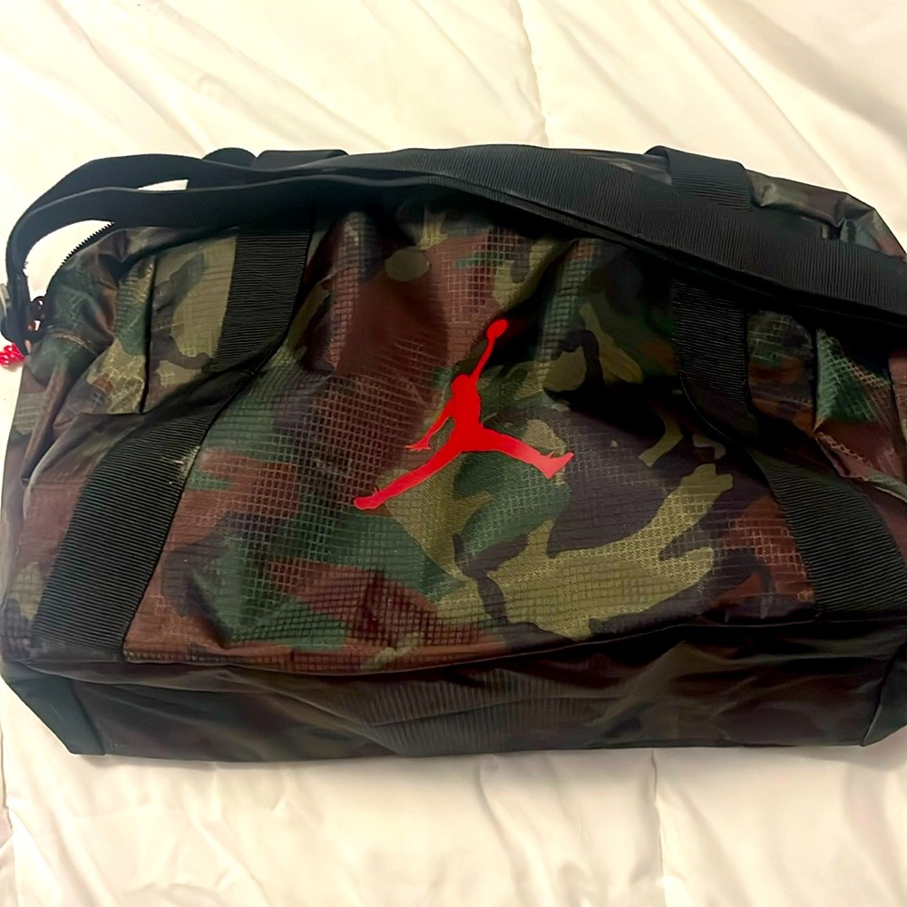 Jordan camo small duffle bag , never used, has handle, longer shoulder strap